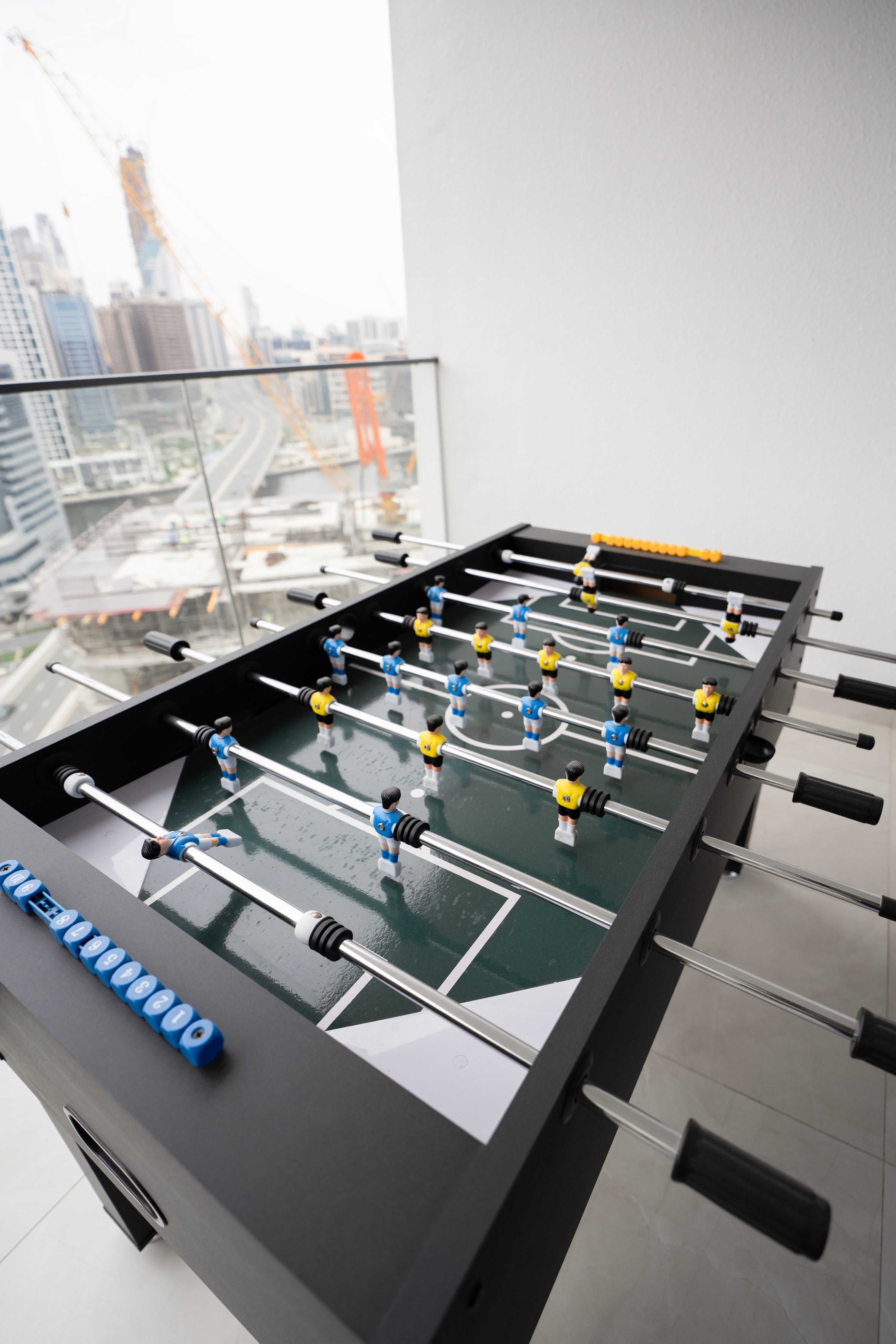 Rentico | Burj View 1BR Apt | Balcony & Foosball — photo 19