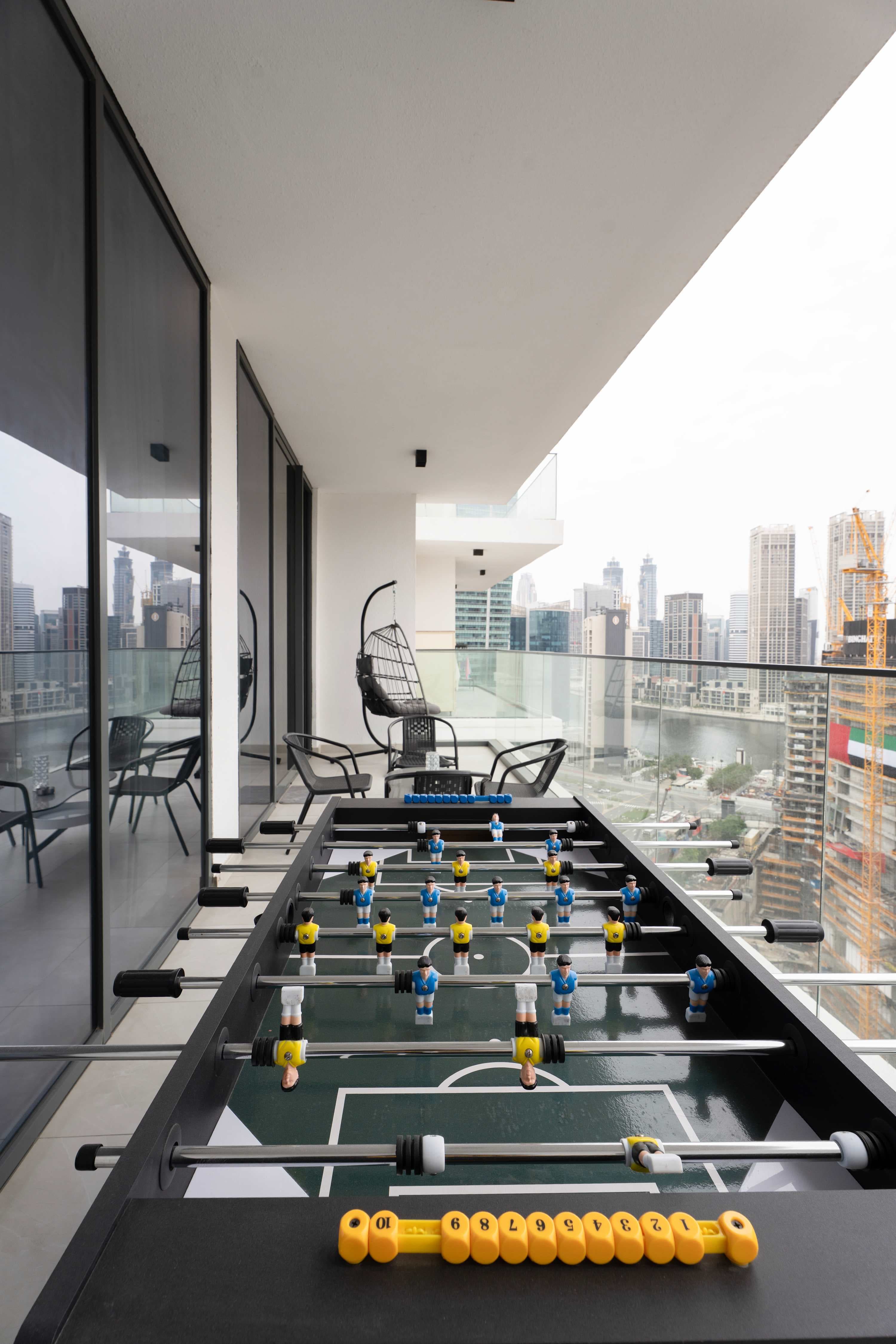 Rentico | Burj View 1BR Apt | Balcony & Foosball — photo 18